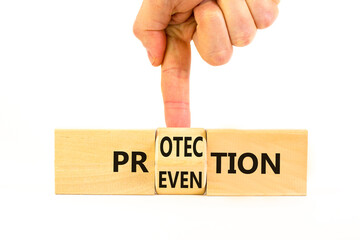 Protection and prevention symbol. Concept word Protection Prevention on wooden cubes. Businessman hand. Beautiful white table white background. Business protection prevention concept. Copy space.