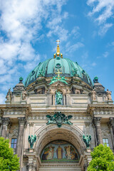 Fototapeta na wymiar Famous central Unter den Linden street, Berlin Cathedral, Berliner Dome in historical and business downtown of Berlin, Germany, at summer sunny day and blue sky.