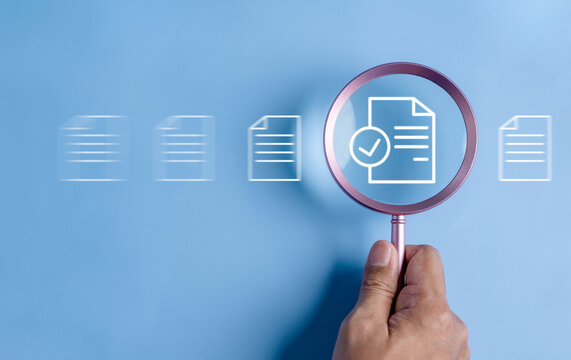 business, document, management, file, corporate, information, laptop, folder, professional, paper. close up to hand, hold magnifier to search file to management. document is important too business.