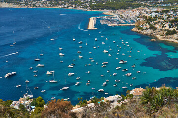 Moraira view from cap d'or with many boats