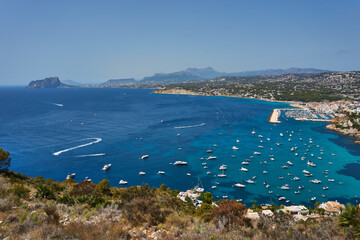 Moraira view from cap d'or with many boats