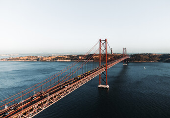 Aerial photos of the 25 April bridge (Ponte 25 de Abril) located in Lisbon, Portugal, crossing the Targus river - taken by drone.