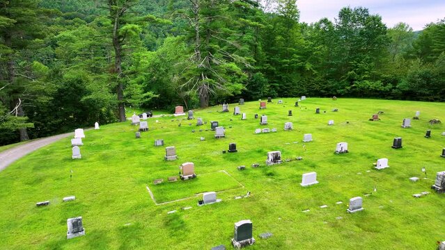 Low and slow passing flight over cemetary near Sharon, VT.