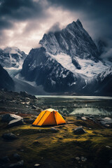 Majestic mountain landscape with orange tent near large glacier  under clouds