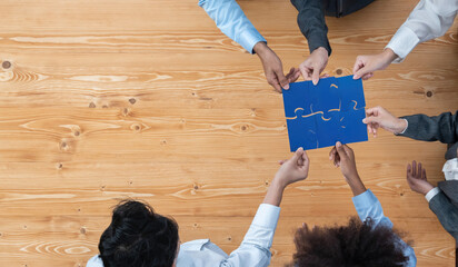 Panorama top view diverse corporate officer worker collaborate in office connect puzzle piece as...