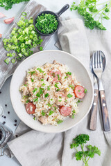 Chicken bog dish with smocked sausages, traditional South Carolina recipe, vertical, top view