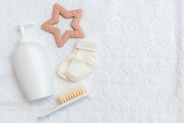 Infant essentials on white surface, top shot with copy space
