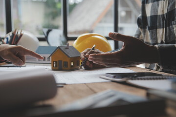 Engineer Teamwork Meeting, Drawing working on blueprint meeting for project working with partner on model building and engineering tools in working site, Construction and structure concept.