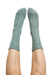 Female legs in blue hand knitted wool socks