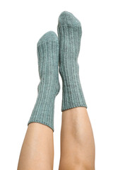 Female legs in blue hand knitted wool socks