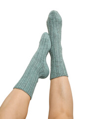 Female legs in blue hand knitted wool socks
