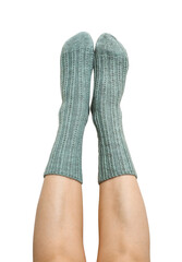 Female legs in blue hand knitted wool socks