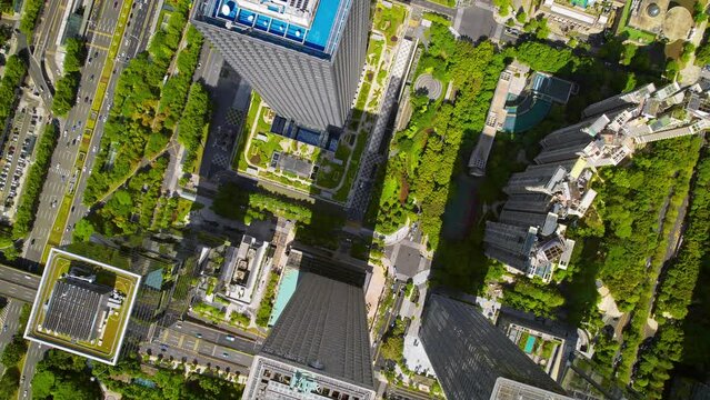 Drone flight above Shenzhen city metropolis, China's innovative, technology hub.
Aerial footage of the financial centre modern skyscrapers surrounded by beautiful green hills