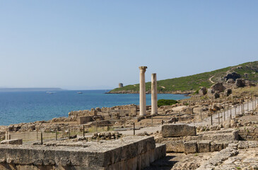 Tharros in Sardinia ruins of ancient roman forum, blue sea