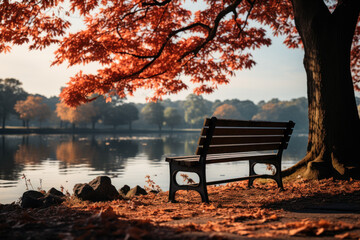 Obraz premium A solitary bench in a park invites passersby to sit and enjoy the tranquil beauty of nature's autumn transformation. Concept of Quiet Contemplation. Generative Ai.