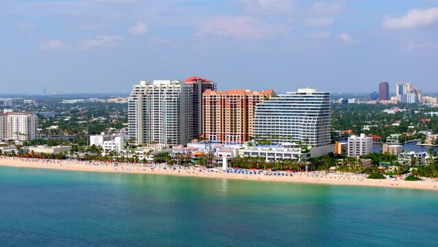 Aerial parallax drone video group of resorts on Fort Lauderdale Beach Florida summer 2023