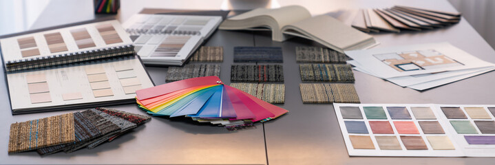 Interior architect designer workstation table, stylish mood board material and various selection color samples art tool design with home blueprint. Creative house renovation or design concept. Insight