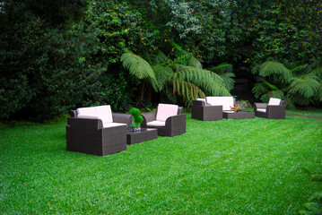 Plastic room installed in outdoor garden, ornamental detail in space covered by grass and old trees. - 642218356