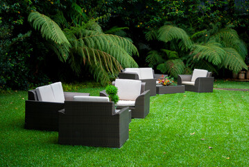 Plastic room installed in outdoor garden, ornamental detail in space covered by grass and old trees. - 642218714