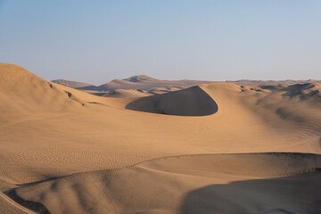 Contrasts between light and shadow in the desert sands