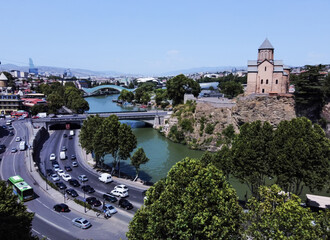 Metekhi church (cathedral) , Metkhi bridge and Kura river and Bridge of Peace in distance and cityscape of Tbilisi © Marat Lala
