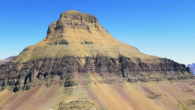 Establishing shot of Reynolds Mountain peak and Twin Lakes valley below Fusillade Mountain, in Glacier National Park, Montana.