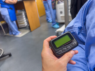 medical communication: A hospital pager signifies instant connection, urgency, and teamwork in healthcare