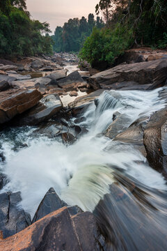 Waterfall cascades,over jagged rocks and boulders at Maak Ngaew falls,near Pakse,Southern Laos.