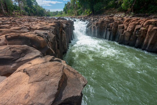 Waterfall cascades,over jagged rocks and boulders at Maak Ngaew falls,near Pakse,Southern Laos.
