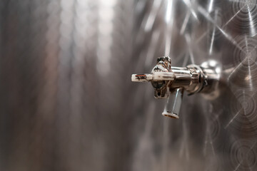 Faucet on wine stainless barrel with blurred background