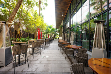 Restaurant tables at a walkway in the city