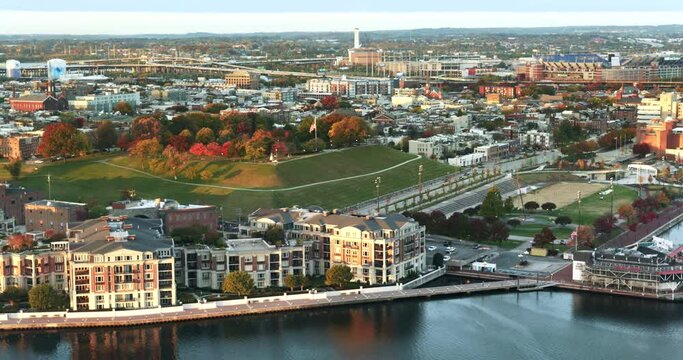 Downtown cityscape and Federal Hill Park on the Inner Harbor of Baltimore Maryland flowing out to the Patapsco River and Chesapeake Bay