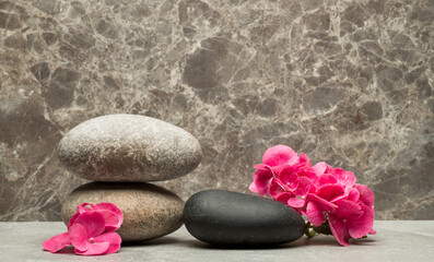 Fototapeta na wymiar stones and flowers for the podium.zen stones and flowers for the presentation of the product, background, podium.