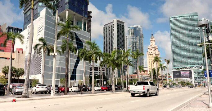 Cars and traffic move along the downtown business and shopping areas in the financial district of Miami