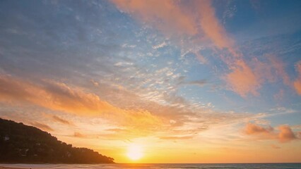 Watching the sky in time lapse reveals the ever changing movement of the clouds, .the gradual changes in light as the time passes..scene romantic bright yellow sky in sunset at Karon beach. - Powered by Adobe