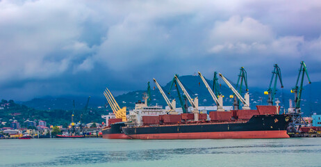Batumi sea port with cranes ships, ferries. Logistic, industry, shipping, trade concept © bborriss