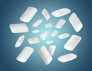 Many chewing gum pads falling on blue background