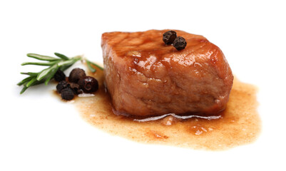 Piece of delicious cooked beef, rosemary and peppercorns isolated on white. Tasty goulash