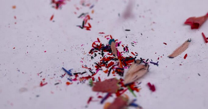 shavings and pieces of lead on paper after sharpening pencils, preparing pencils for use in teaching and drawing