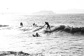 Surfers on the beach. Sea sport leisure background image.