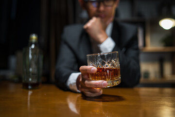 Businessmen in suits drinking whiskey