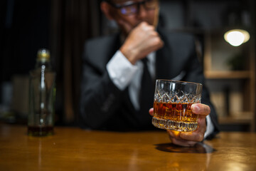 Businessmen in suits drinking whiskey