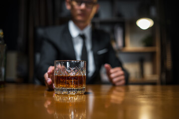 Businessmen in suits drinking whiskey
