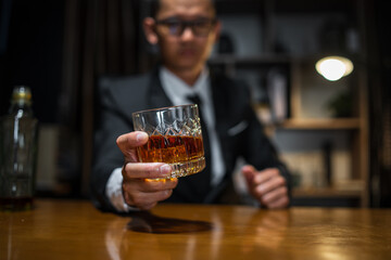 Businessmen in suits drinking whiskey