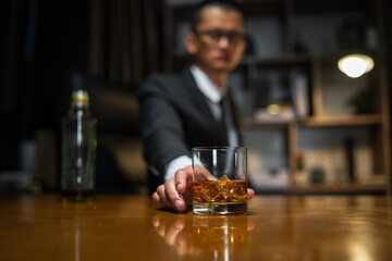 Businessmen in suits drinking whiskey