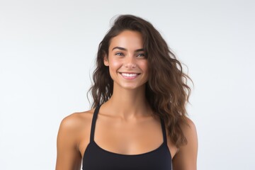 Fototapeta premium Portrait of a smiling sportswoman in black sportswear isolated on a white background and Looking at the camera.