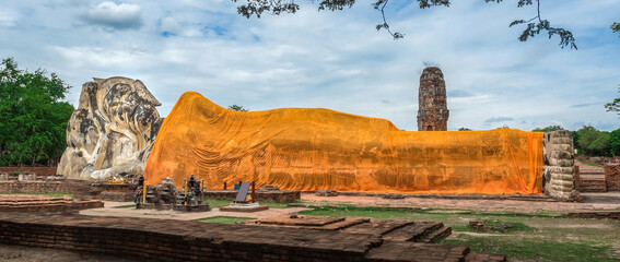 Big antique reclining buddha at Wat Lokayasutharam Temple World heritage in Ayutthaya Thailand