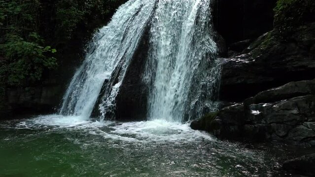 Aerial slow motion dolly shot of Janets Foss in Yorkshire.