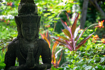 Balinese statue in a garden