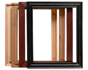 Four empty photo or art frames stained in light brown, tan, mahogany, and black, stacked on top of one another to show their contrasting stain colors and designs.